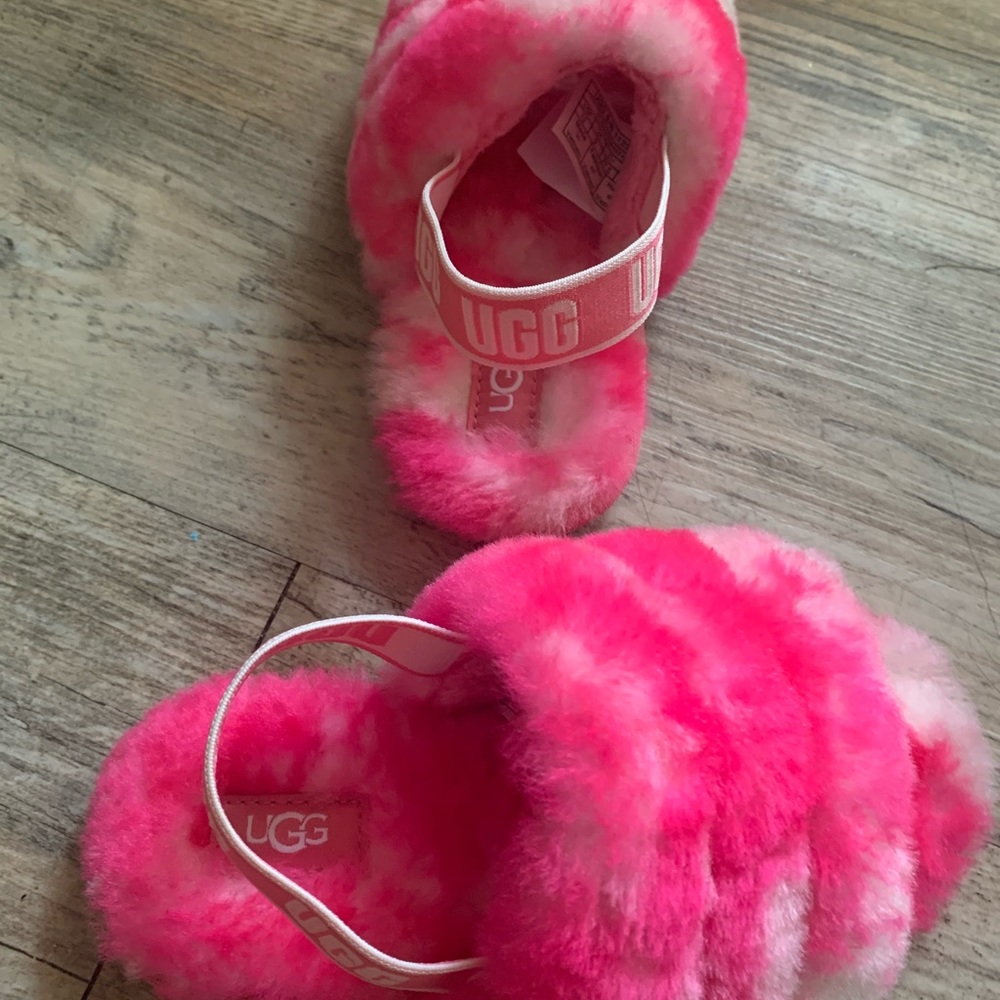 Pink and white kids Ugg slides